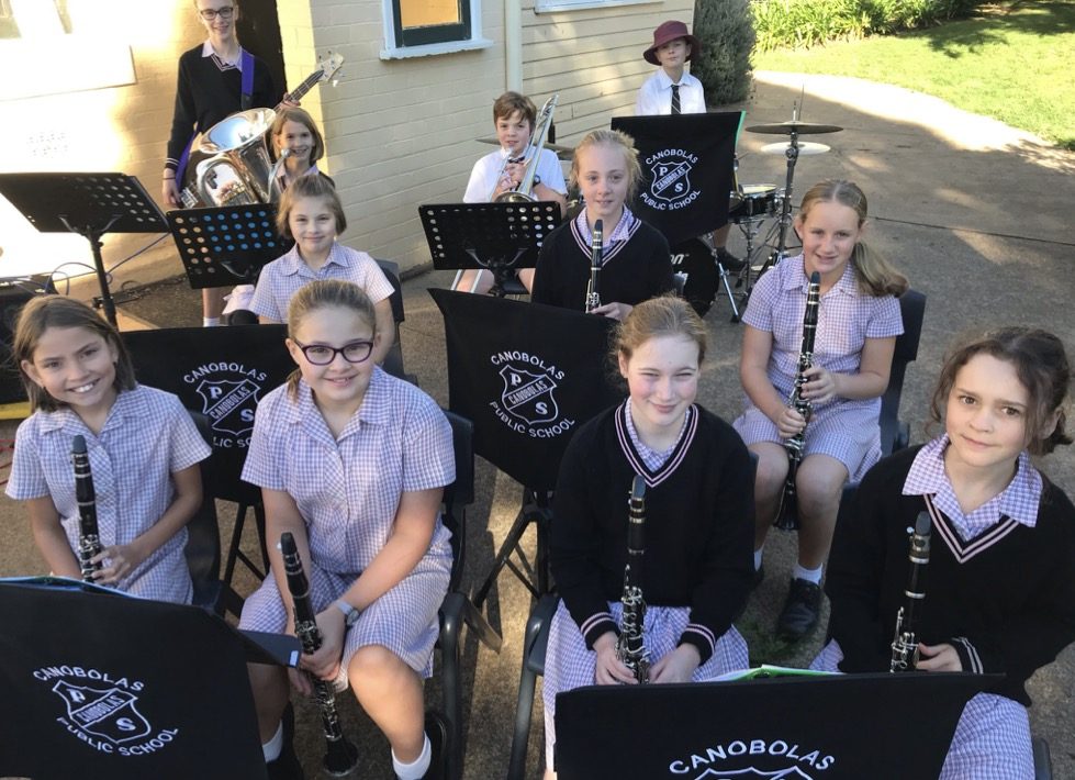 The senior band's woodwind section playing clarinets outdoors in Canobolas Public School uniform